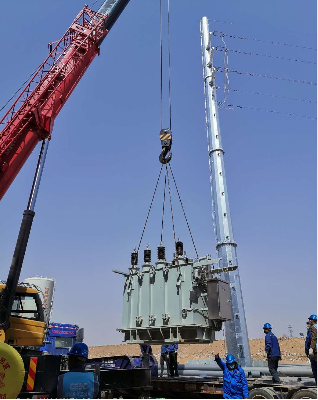 國(guó)源公司榆林生活垃圾發(fā)電項(xiàng)目主變壓器成功就位 (1).jpg